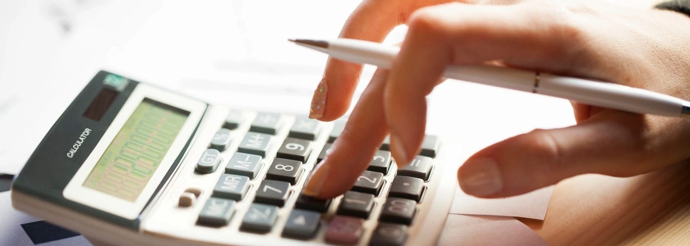 Financial advisor consulting clients in a warm, modern office